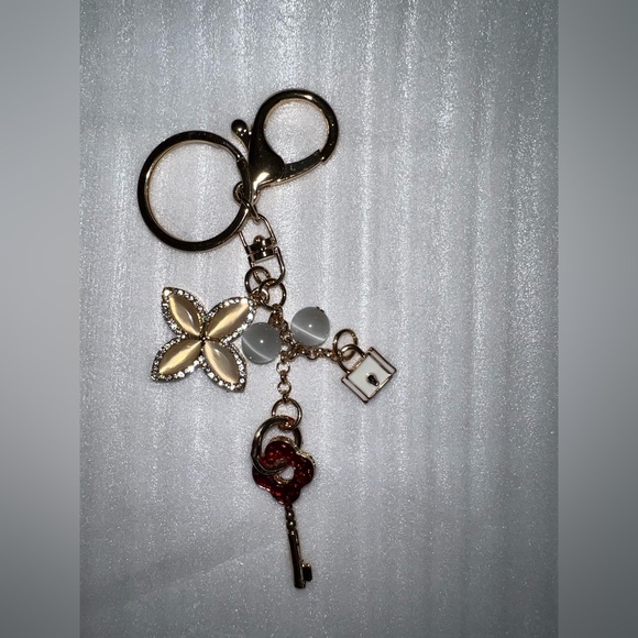 Gold-tone keychain bag charm floral design and lock and key accents - Picture 2 of 5